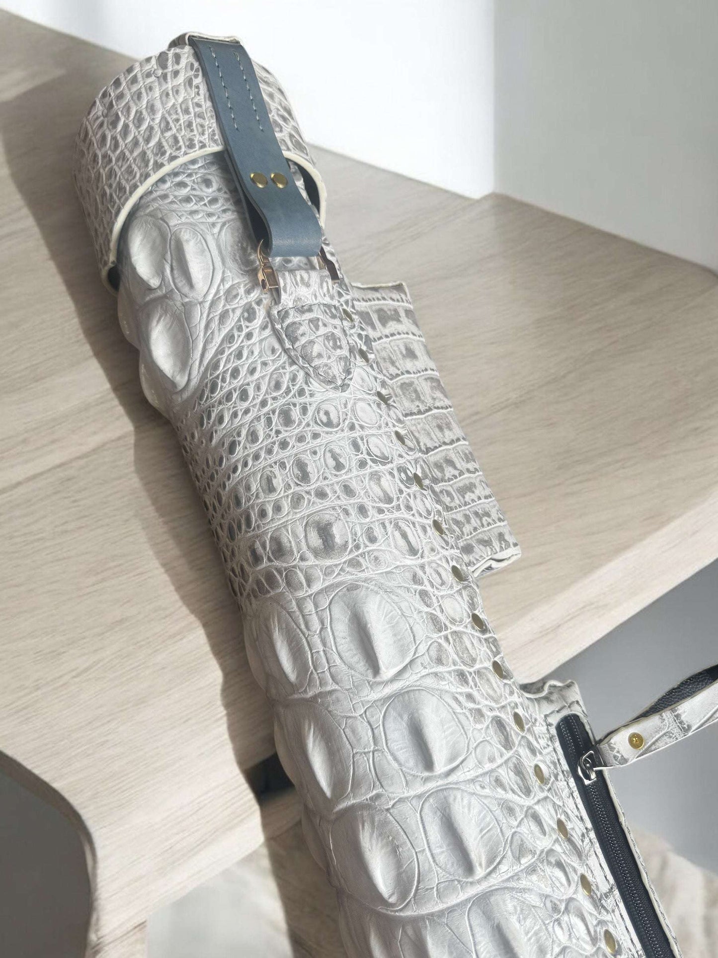 Back close-up of Crocodile Signature custom leather cue case with genuine crocodile leather detailing