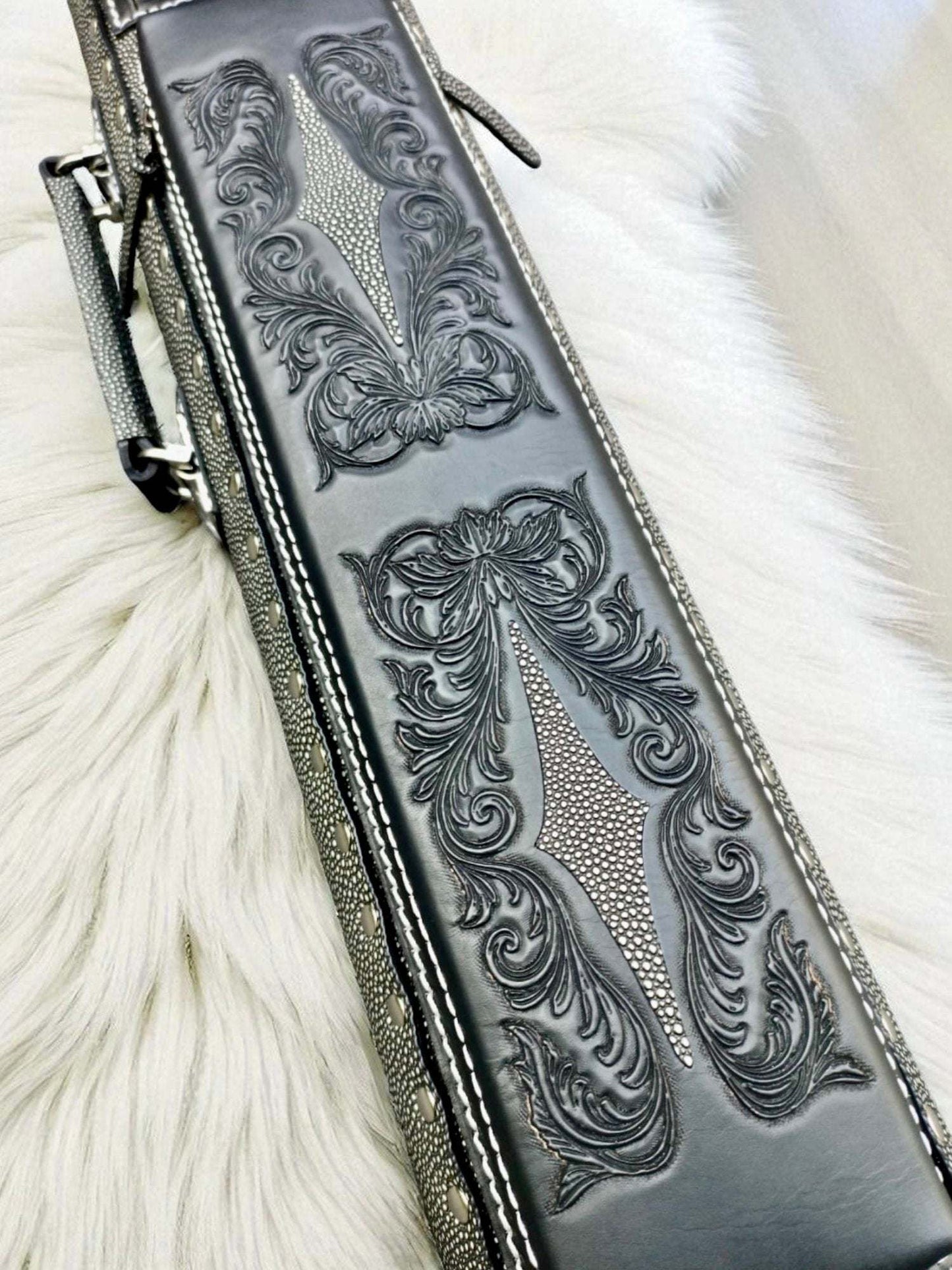 Front close-up view of the black Vicri Stingray vegetable-tanned cowhide cue case with a stingray-embossed body.