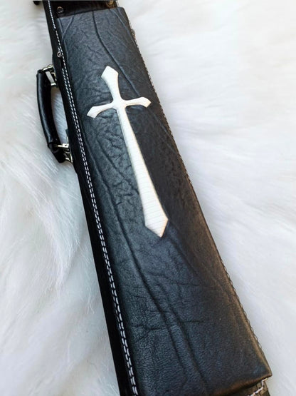 Close-up of Crusade black leather cue case with white cross inlay, textured leather, and fine stitching