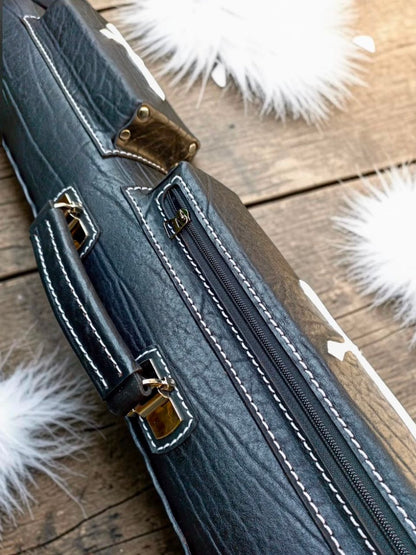 Side close-up of Crusade black leather cue case with white cross inlay, textured leather, and fine stitching