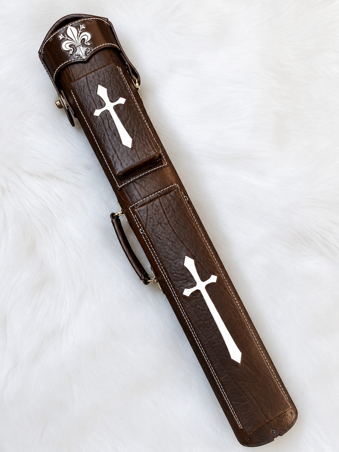 Front view of Crusade brown leather cue case with cross inlays, fleur-de-lis detailing, and handmade finish