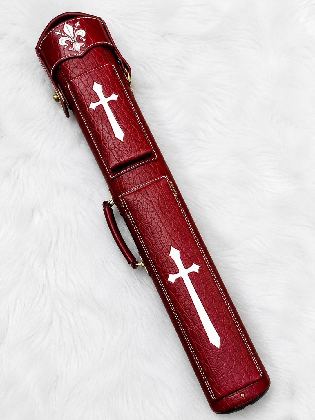 Front view of Crusade red leather cue case with cross inlays, fleur-de-lis cap, and handcrafted finish