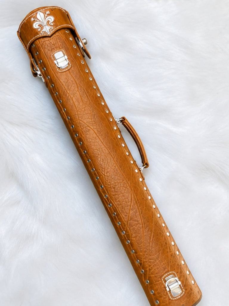 Back view of Crusade tan leather cue case with hand-carved fleur-de-lis detail on the top lid and handmade finish