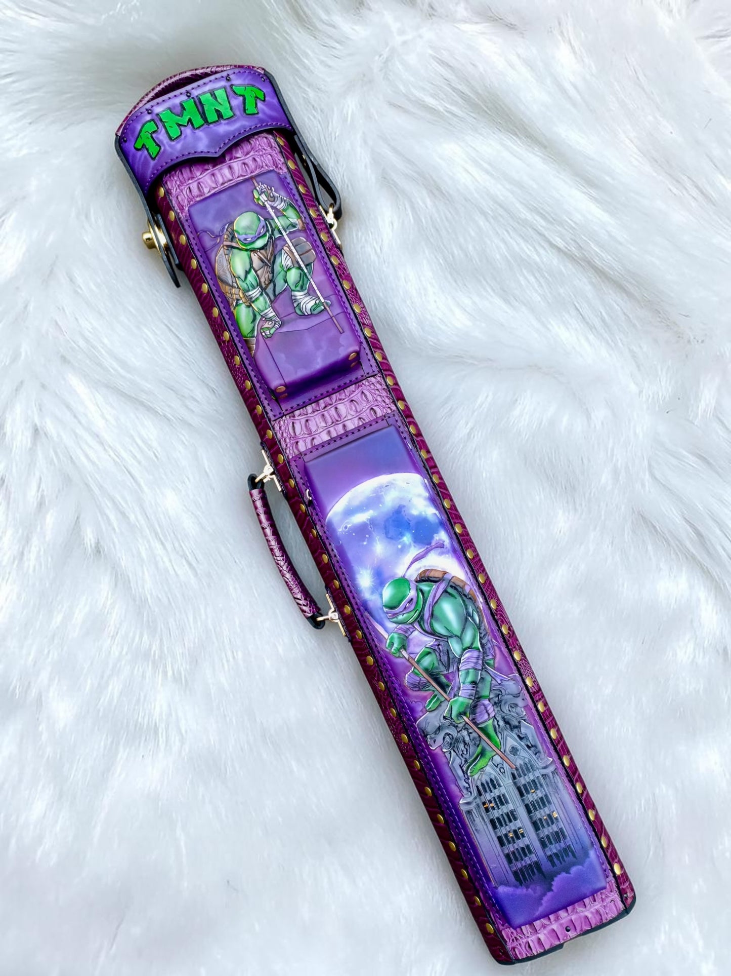 TMNT Donatello leather cue case front with hand-painted artwork and purple leather.